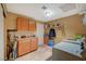 Functional laundry room with ample storage, utility sink, and modern appliances for efficient chore management at 4424 Shady Hollow Ave, North Las Vegas, NV 89031