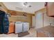 Functional laundry room with modern washer, dryer, storage cabinets, and ample countertop space at 4424 Shady Hollow Ave, North Las Vegas, NV 89031