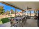 Outdoor patio with dining and seating areas, perfect for alfresco dining and enjoying the backyard oasis at 4424 Shady Hollow Ave, North Las Vegas, NV 89031