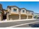 Three-unit townhome building with attached garages at 4495 Violet Flowers St # 2046, North Las Vegas, NV 89031