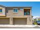 Two-story townhome with attached garage and balcony at 4495 Violet Flowers St # 2046, North Las Vegas, NV 89031