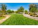 A well-maintained green space features lush grass, winding pathways and mature trees for all to enjoy at 4495 Violet Flowers St # 2046, North Las Vegas, NV 89031