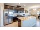 Stainless steel appliances and granite countertops in this kitchen at 4495 Violet Flowers St # 2046, North Las Vegas, NV 89031