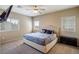 Spacious main bedroom with ceiling fan and plush bedding at 4495 Violet Flowers St # 2046, North Las Vegas, NV 89031