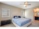 Main bedroom with attached bath, and a large bed at 4495 Violet Flowers St # 2046, North Las Vegas, NV 89031