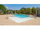 Community swimming pool and splashpad surrounded by lush landscaping for Gathering fun in the sun at 4495 Violet Flowers St # 2046, North Las Vegas, NV 89031