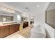 Spa-like main bathroom with a soaking tub, granite counters, and elegant vanity area at 4499 Amazing View St, Las Vegas, NV 89129