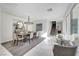 Bright dining room with white marble floors, a modern chandelier, and stylish seating at 4499 Amazing View St, Las Vegas, NV 89129