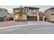 Beautiful two-story stucco home with a three-car garage and desert landscaping at 4499 Amazing View St, Las Vegas, NV 89129