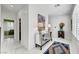 Bright foyer with white marble floors, a mirrored console table, and elegant decor at 4499 Amazing View St, Las Vegas, NV 89129