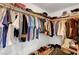 Walk-in closet featuring a variety of clothing, shoes, and luggage with ample storage space at 4499 Amazing View St, Las Vegas, NV 89129