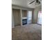 Living room with fireplace and sliding door to patio at 5018 Rio Linda Cir, North Las Vegas, NV 89031