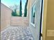 Private patio with paver stones and tall trees offering shade and privacy at 5249 Fiery Sky Ridge St, Las Vegas, NV 89148