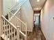 Elegant staircase with white railings and carpeted stairs at 5249 Fiery Sky Ridge St, Las Vegas, NV 89148