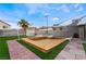 Large backyard with pool, deck, and artificial turf at 5509 Evergreen Ave, Las Vegas, NV 89107