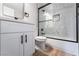 Modern bathroom featuring a white vanity and marble shower surround at 5509 Evergreen Ave, Las Vegas, NV 89107