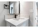 Bathroom with a white vanity and a modern black framed mirror at 5509 Evergreen Ave, Las Vegas, NV 89107