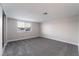 Simple bedroom with gray carpet and window at 5509 Evergreen Ave, Las Vegas, NV 89107