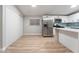 Modern kitchen with stainless steel appliances and white cabinets at 5509 Evergreen Ave, Las Vegas, NV 89107