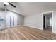 Bright living room featuring light wood floors and a view to the kitchen at 5509 Evergreen Ave, Las Vegas, NV 89107