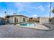 Backyard oasis featuring a kidney-shaped pool and gravel landscaping at 5509 Evergreen Ave, Las Vegas, NV 89107