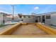 Large wooden deck surrounding a refreshing pool at 5509 Evergreen Ave, Las Vegas, NV 89107