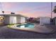 Kidney shaped pool in a remodeled backyard at 5509 Evergreen Ave, Las Vegas, NV 89107