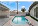 Relaxing kidney shaped pool with a pergola and spacious yard at 5509 Evergreen Ave, Las Vegas, NV 89107