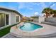 Relaxing kidney-shaped pool with a view of the house at 5509 Evergreen Ave, Las Vegas, NV 89107