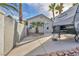 View of a charming backyard featuring an RV, palm trees and a basketball hoop on a sunny day at 6005 Blowing Bellows St, Las Vegas, NV 89130