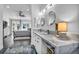 Bright bathroom featuring double sinks with marble countertop and decorative circular mirrors at 6005 Blowing Bellows St, Las Vegas, NV 89130