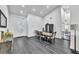 Bright dining room features wood floors, stylish furnishings and lots of natural light at 6005 Blowing Bellows St, Las Vegas, NV 89130