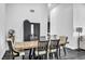 Dining room featuring hardwood floors, a long table, and views into living area at 6005 Blowing Bellows St, Las Vegas, NV 89130