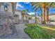 Charming home exterior with stone accents, desert landscaping, and a welcoming walkway at 6005 Blowing Bellows St, Las Vegas, NV 89130