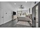 Spacious main bedroom featuring a ceiling fan, hardwood floors, and access to a private outdoor space at 6005 Blowing Bellows St, Las Vegas, NV 89130