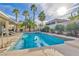 Relaxing pool surrounded by lush greenery, offering a private oasis for leisure and entertainment at 6005 Blowing Bellows St, Las Vegas, NV 89130