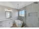 Bright bathroom featuring a luxurious bathtub and a separate glass-enclosed shower at 6027 Stone Hollow Ave, Las Vegas, NV 89156