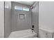 Beautiful bathroom featuring vertical tiles and a modern shower head at 6027 Stone Hollow Ave, Las Vegas, NV 89156