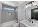 Beautiful bathroom featuring vanity with stone countertop and shower over tub combination at 6027 Stone Hollow Ave, Las Vegas, NV 89156