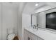 Stylish powder room with modern vanity and a large mirror at 6027 Stone Hollow Ave, Las Vegas, NV 89156