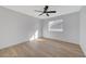 Well-lit bedroom with a ceiling fan and a large window, enhancing natural light at 6027 Stone Hollow Ave, Las Vegas, NV 89156