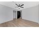 Bedroom featuring a ceiling fan and a doorway that leads to closet and a hallway at 6027 Stone Hollow Ave, Las Vegas, NV 89156