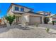 Charming two-story home featuring a two-car garage and low-maintenance desert landscaping at 6027 Stone Hollow Ave, Las Vegas, NV 89156