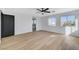 Bright main bedroom with a ceiling fan and two windows that allow ample natural light at 6027 Stone Hollow Ave, Las Vegas, NV 89156