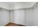 A clean and simple walk-in closet with white shelving ready to be organized at 6027 Stone Hollow Ave, Las Vegas, NV 89156