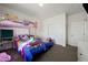 Bedroom with bunk beds, colorful bedding, and storage at 6101 Cavalry Trl, Pahrump, NV 89060