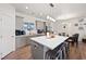 Modern kitchen with gray cabinets, island, and stainless steel appliances at 6101 Cavalry Trl, Pahrump, NV 89060