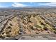 Scenic aerial view of a well-maintained golf course surrounded by lush landscaping and homes at 6151 Moonlight Sonata Ave, Las Vegas, NV 89122