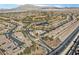 Overhead shot of a golf course neighborhood with tree-lined streets and a beautiful water feature at 6151 Moonlight Sonata Ave, Las Vegas, NV 89122