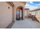 Stylish single-story home featuring a unique front door and desert-style landscaping at 6151 Moonlight Sonata Ave, Las Vegas, NV 89122